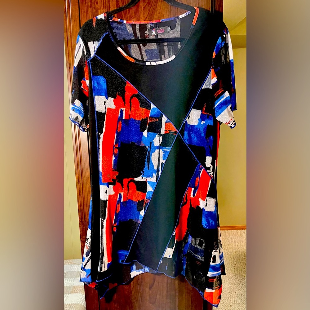 Asymmetrical tunic top with red, blue and black. Flows well and easy to wear